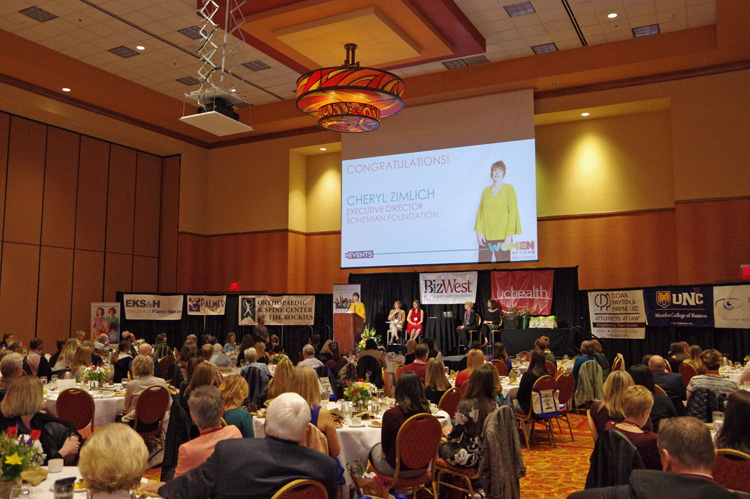 The full ballroom with the stage screen in the distance