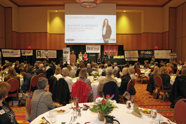 Guests at round tables during the program