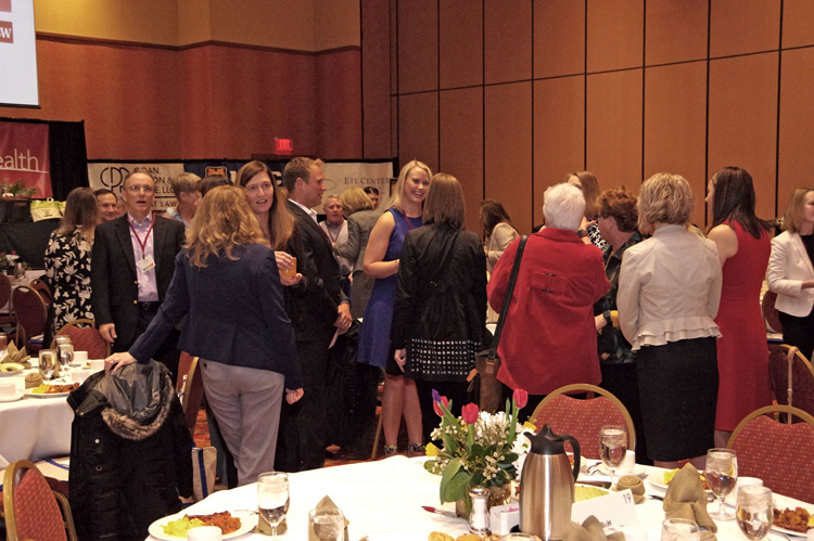Guests standing among the tables