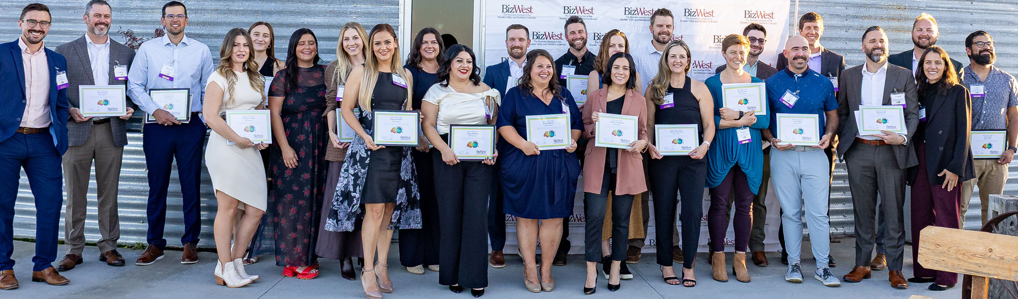 The 2025 40 Under Forty honorees holding their certificates