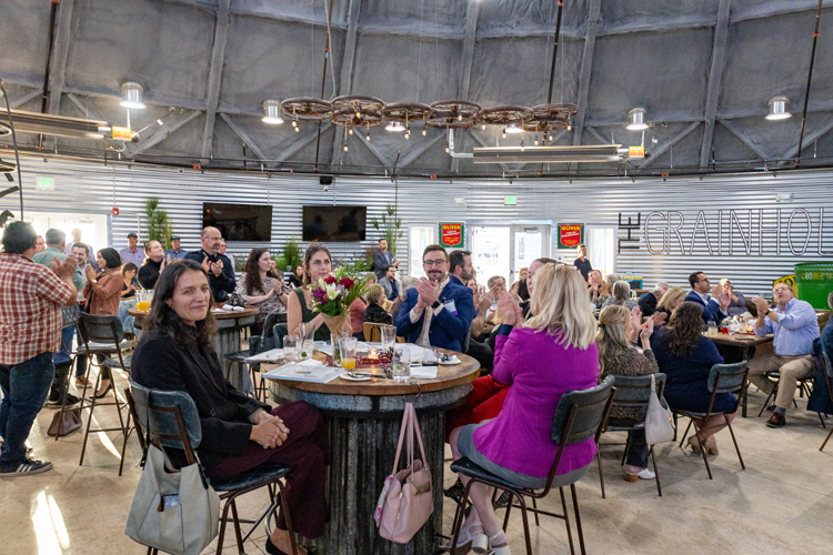 Guests seated at tables during the 2025 program