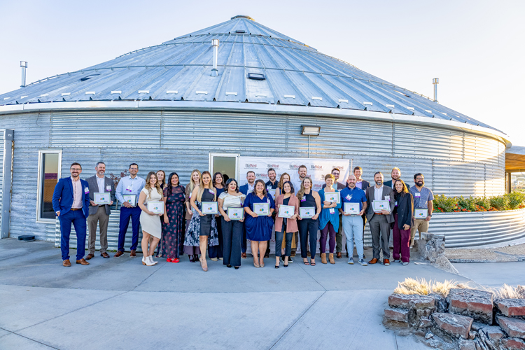 The 2025 class gathered with their certificates outside the venue