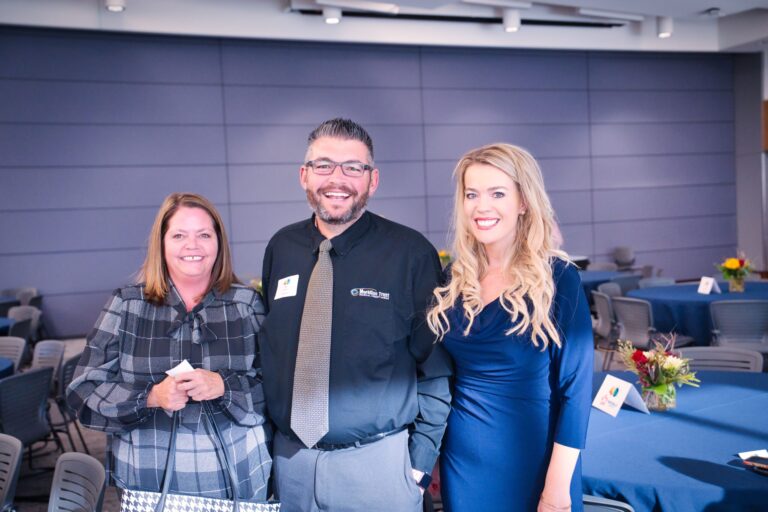 Three guests posing in the hall
