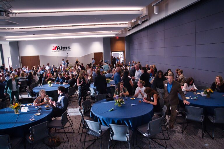 Guests at round tables in the hall