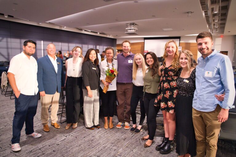 A group of guests posing together in the hall
