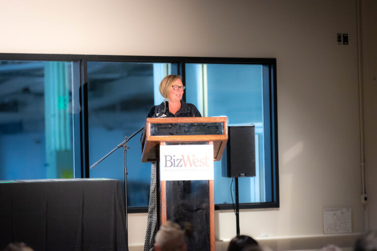 A speaker at the BizWest podium