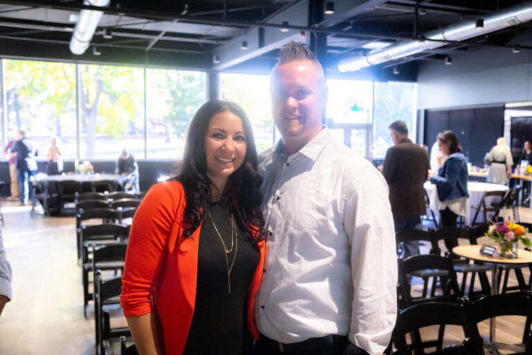 Two guests posing together before the program