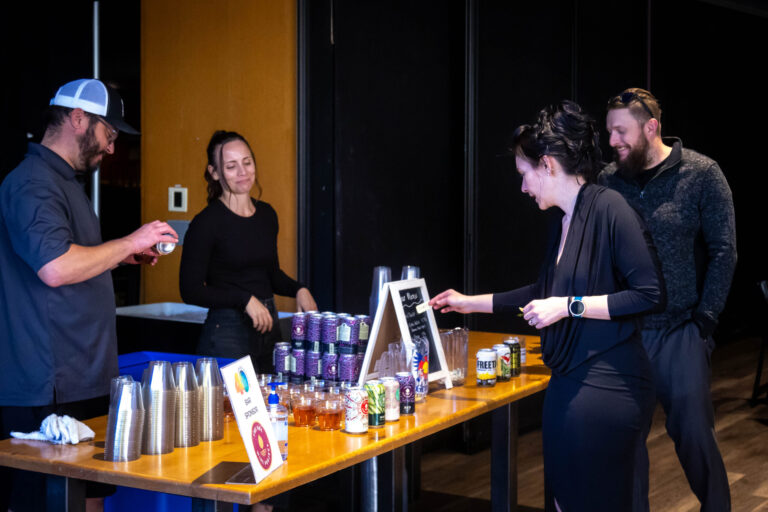 Guests at a drinks station during the reception