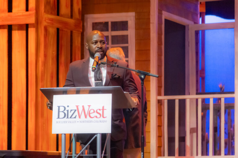 A speaker at the BizWest podium during the 2025 program