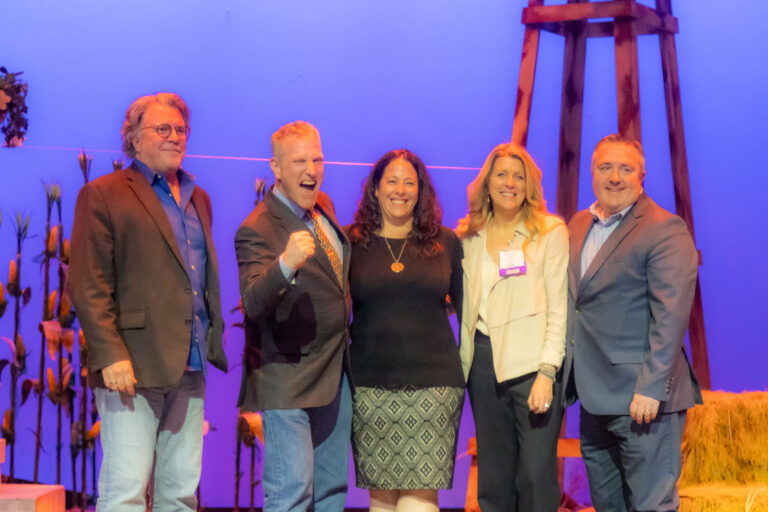 A group of honorees on stage at the 2025 Most-Influential Business Leaders event