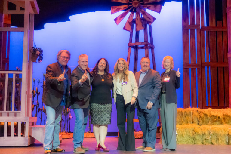 Honorees line up on stage at the 2025 Most-Influential Business Leaders event