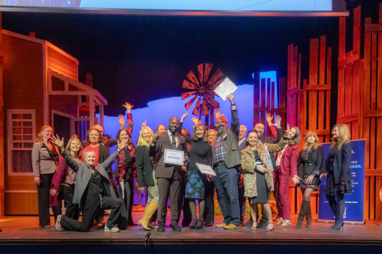 Honorees celebrate on stage at the 2025 Most-Influential Business Leaders event