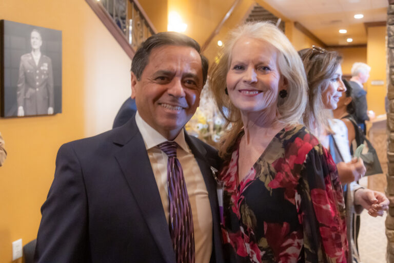 Two guests smile for the camera at the 2025 Most-Influential Business Leaders reception