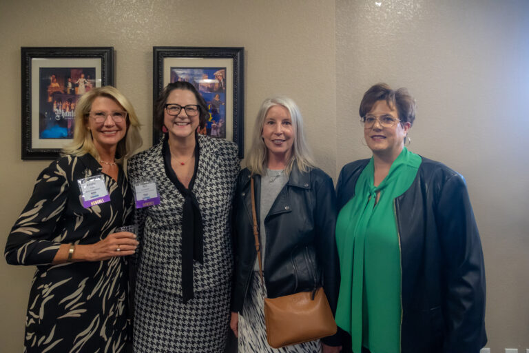 Four guests pose together at the 2025 Most-Influential Business Leaders reception