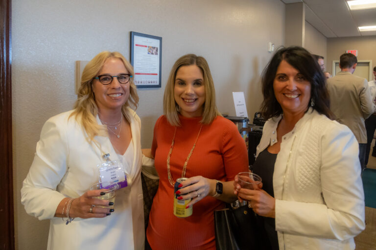 Three guests pose at the 2025 Most-Influential Business Leaders reception