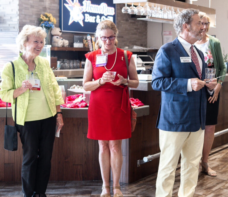 Three guests talking at the reception