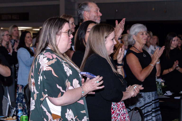 Guests standing and applauding