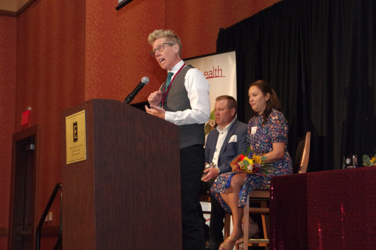 A speaker at the podium on stage