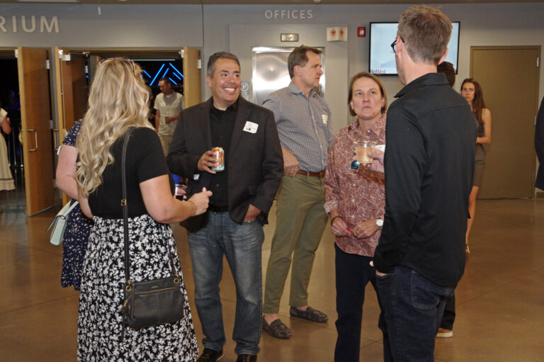 A group of guests talking during the reception