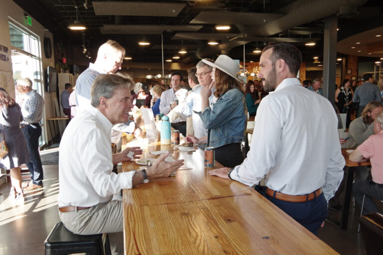 Guests chatting at a long counter