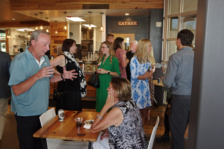 Guests mingling near the Gather room
