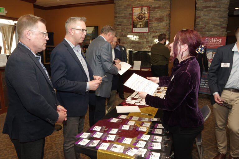 Guests check in at the registration table at the 2024 Book of Lists Launch Party