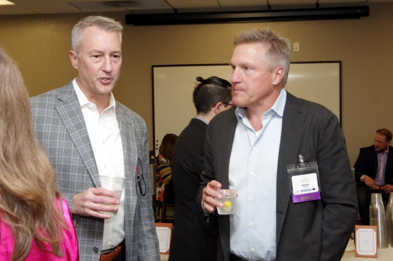 Two guests talk over drinks at the 2024 Book of Lists Launch Party