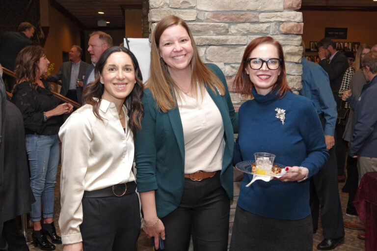 Three guests pose at the 2024 Book of Lists Launch Party reception