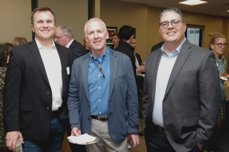 Three guests pose at the 2024 Book of Lists Launch Party reception