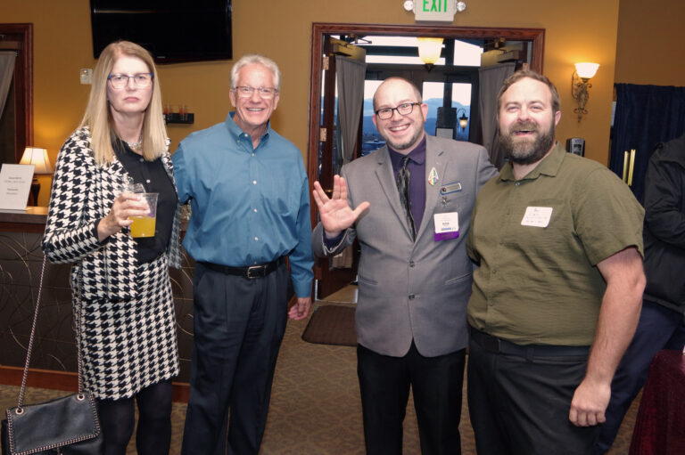 Four guests pose at the 2024 Book of Lists Launch Party reception