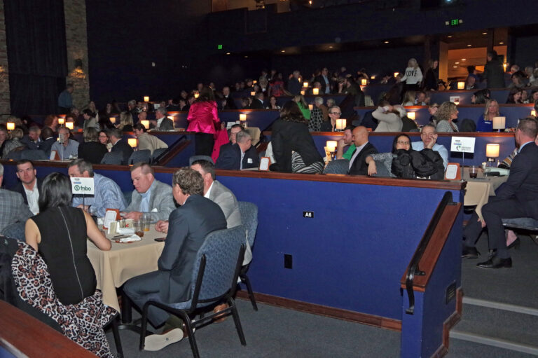 Guests seated at tables in the theater during the 2024 Book of Lists Launch Party