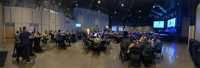 The event hall set with tables in front of the stage